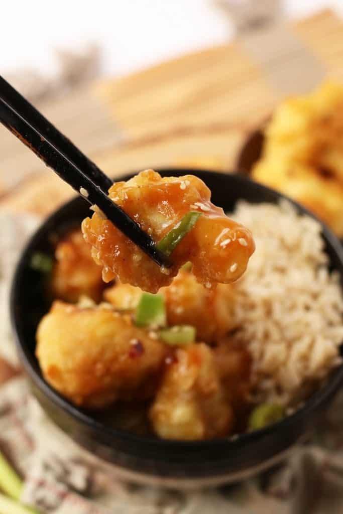 Finished dish in a bowl with chopsticks