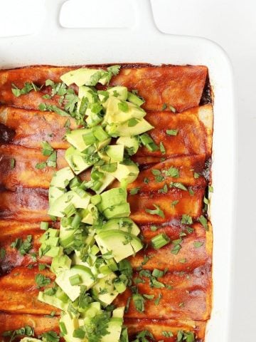 Vegan Enchiladas in a white casserole dish