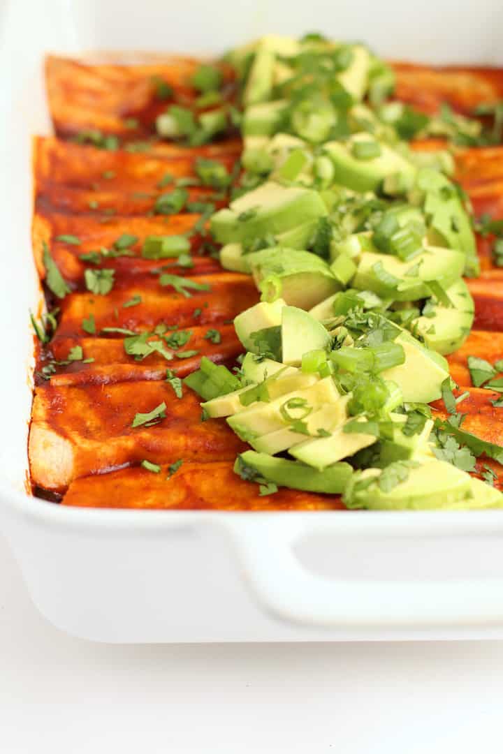 Vegan Enchiladas in a white casserole dish