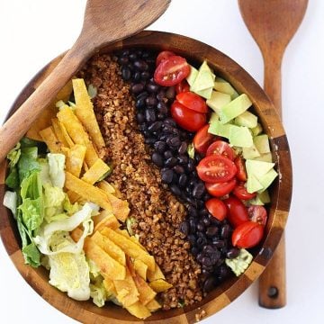 Finished salad in a wooden salad bowl