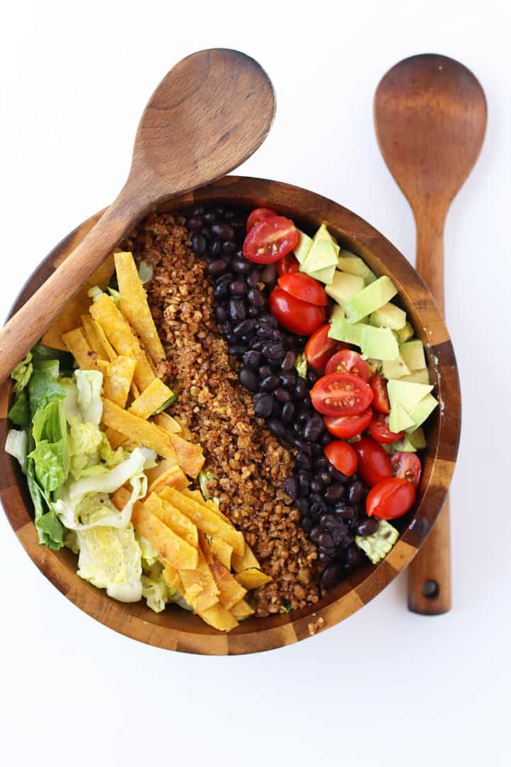 Finished salad in a wooden salad bowl