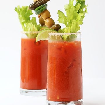 Two Bloody Mary's on a white background