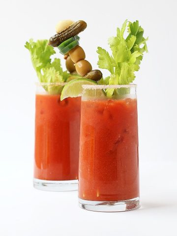 Two Bloody Mary's on a white background