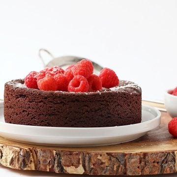 Finished cake topped with fresh raspberries