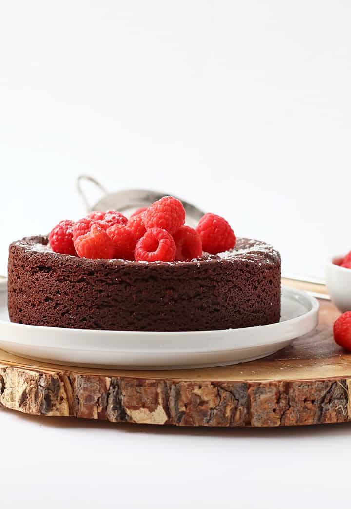 Finished cake topped with fresh raspberries