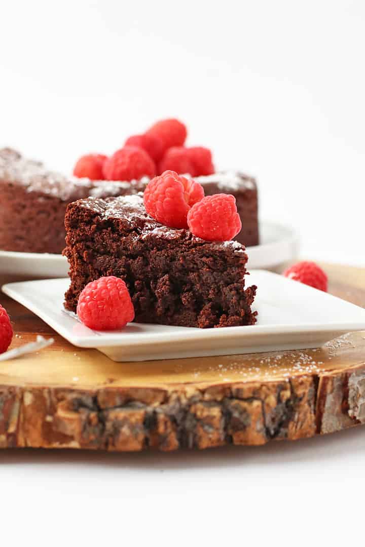 Slice of chocolate cake on a white plate