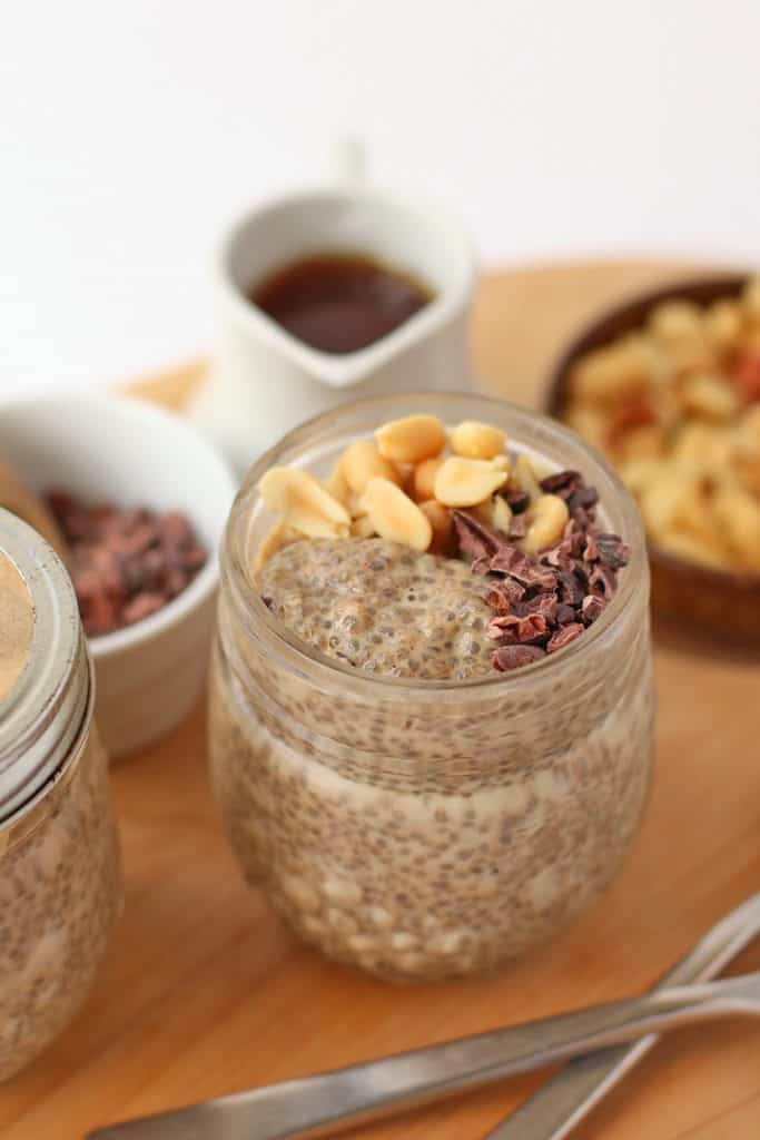 Finished dish in a glass jar with peanuts and cacao nibs