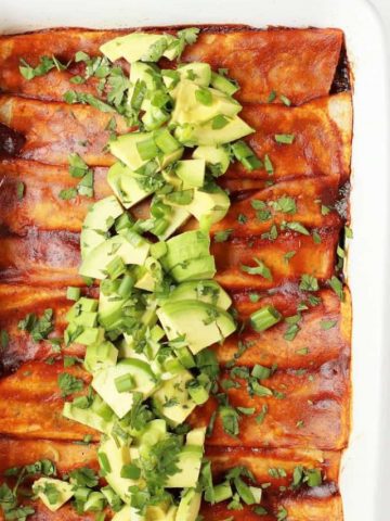Vegan Enchiladas in a white casserole dish