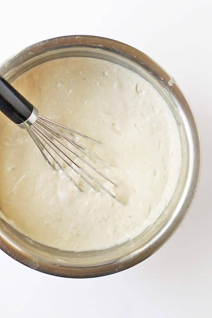 Pancake batter in a metal bowl