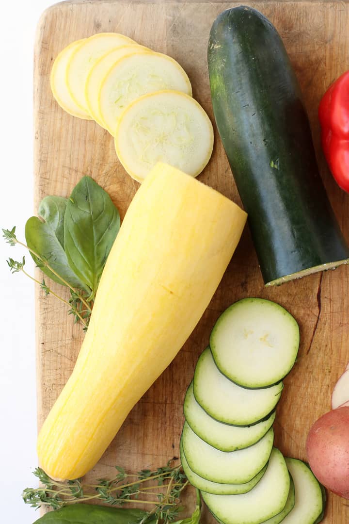 Chopped zucchini and summer squash on a cutting board