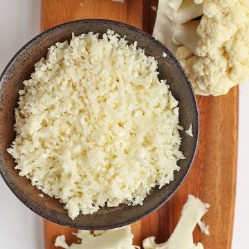 Riced cauliflower on a wooden platter