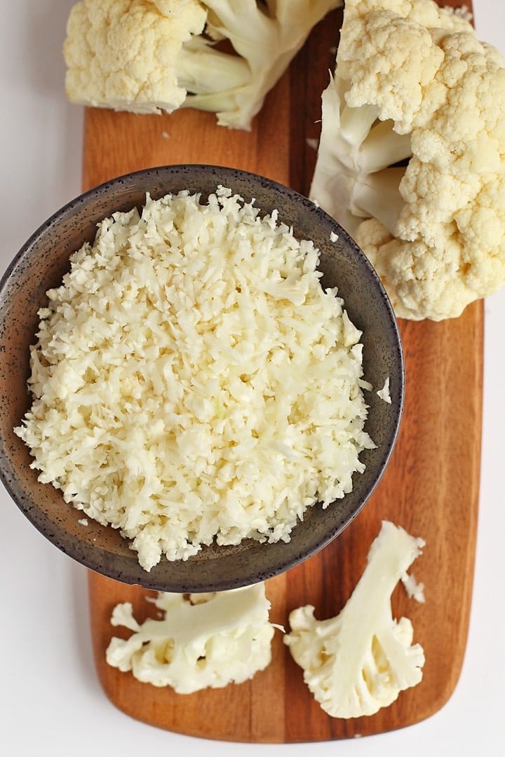 Riced cauliflower on a wooden platter