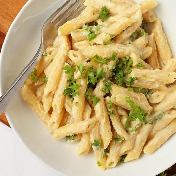 Finished dish in a white bowl with a fork