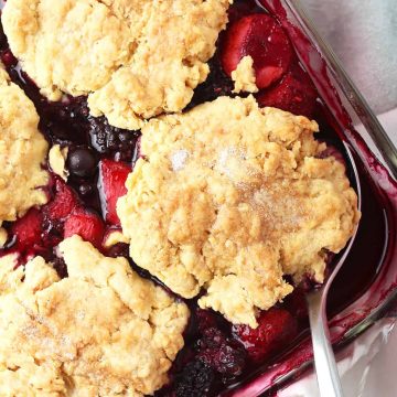 Berry Cobbler in a glass casserole dish