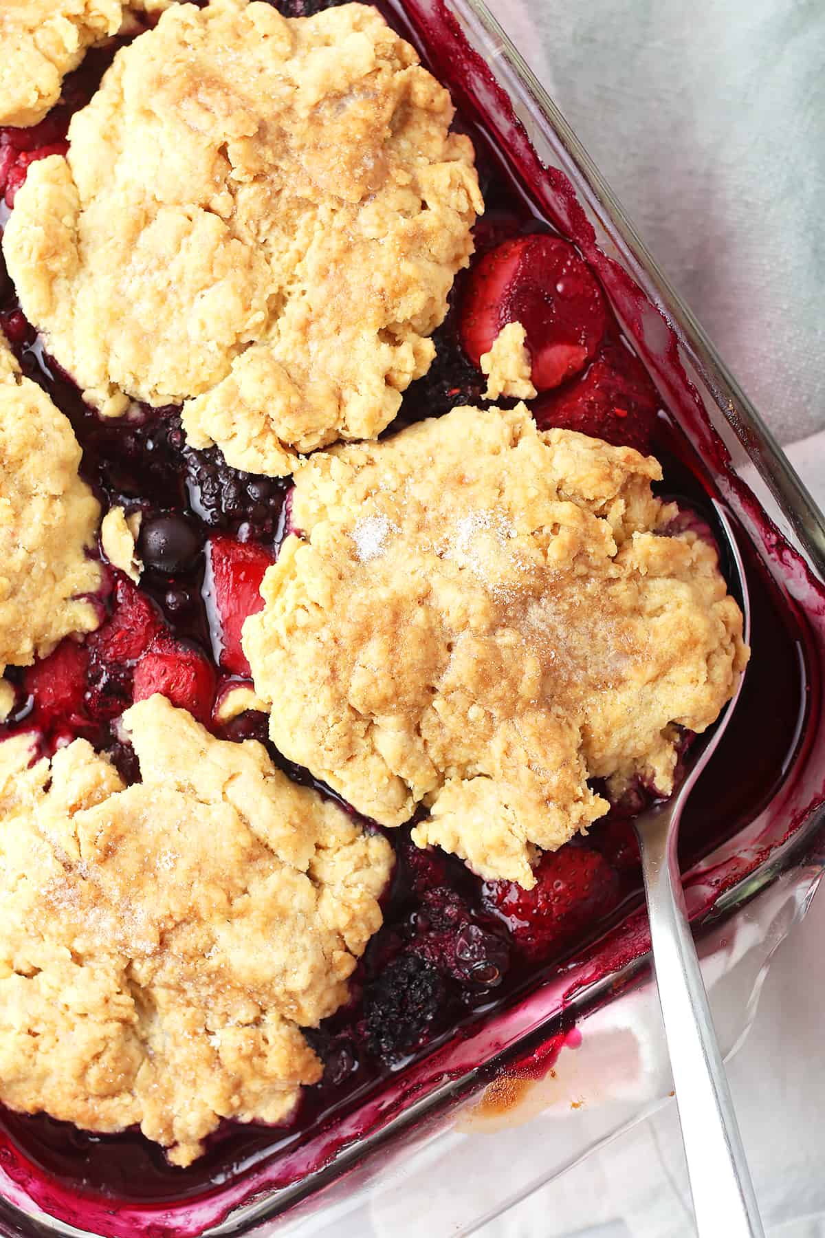 Berry Cobbler in a glass casserole dish