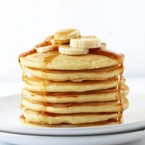 Finished recipe stacked on a white plate with maple syrup