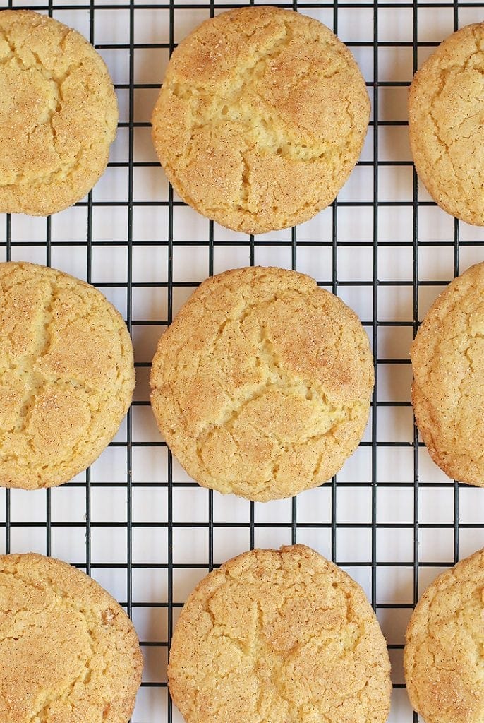 Vegan snickerdoodles on a cooling rack.