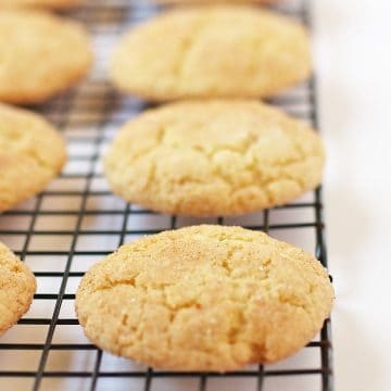 Vegan Snickerdoodles on a cooling rack.