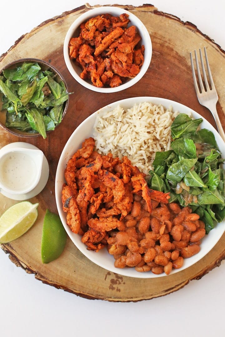 BBQ Soy Curls Bowl on a wooden platter with fresh lime 
