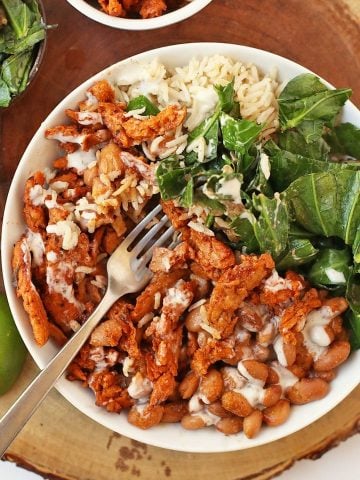 Finished recipe in a white bowl with a fork