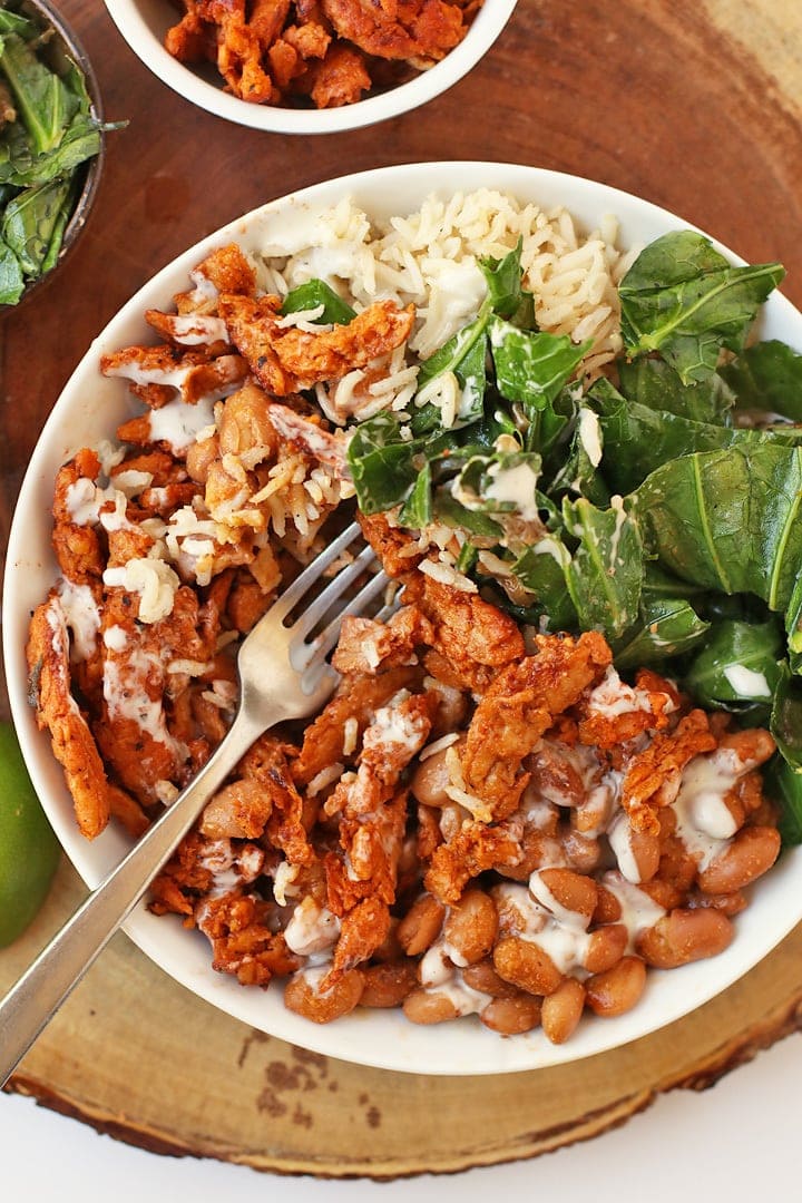 Finished recipe in a white bowl with a fork