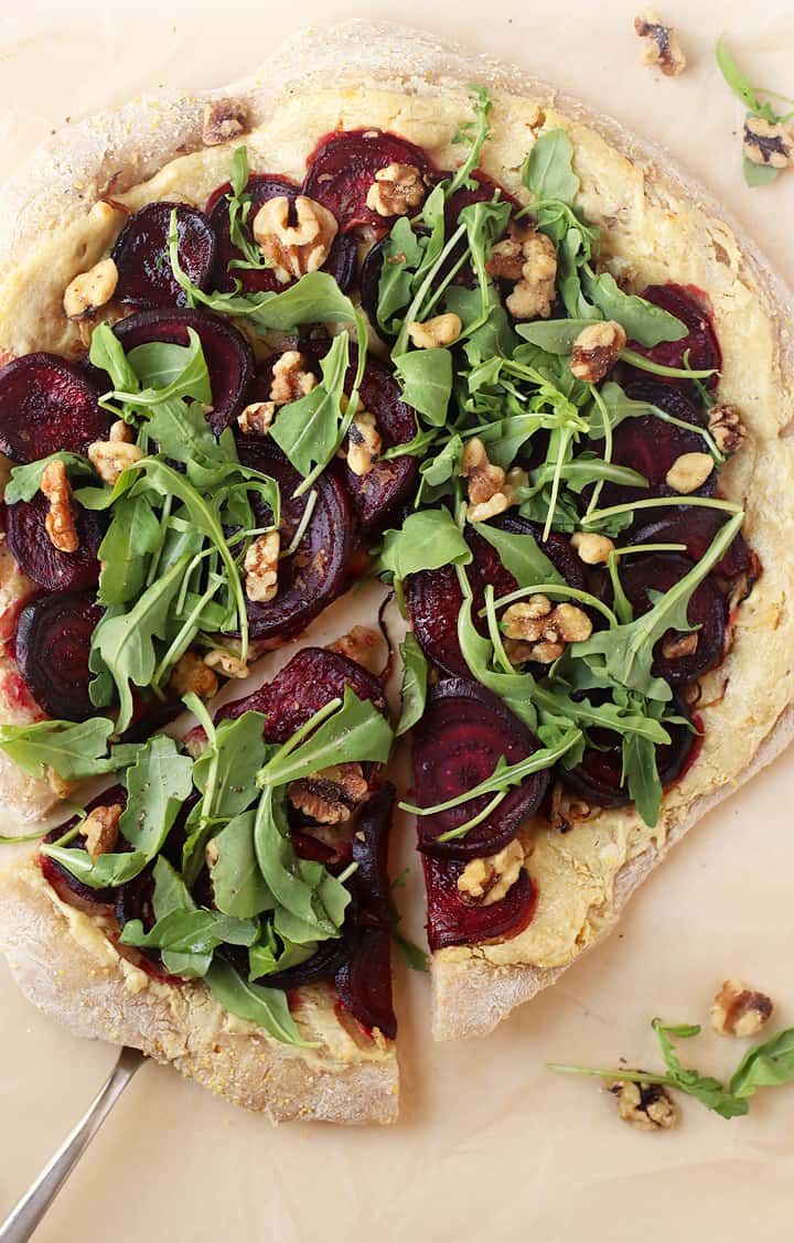 Roasted Beet Pizza with a sliced removed