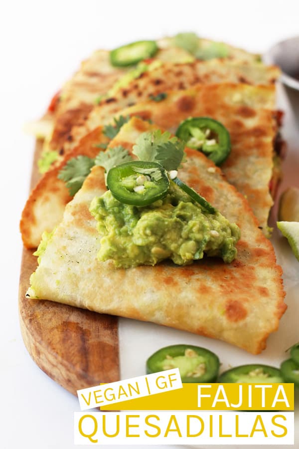 Fully Loaded Vegan Quesadillas – filled with fajita grilled vegetables, black beans, and guacamole and topped with fresh cilantro and jalapeños. Cooked inside a @MissionFoodsUS Gluten Free Soft Taco Tortilla for a delicious vegan and gluten free meal. #MissionGlutenFree #ad #vegan #glutenfree #veganrecipes #quesadillas #vegansnacks #glutenfreerecipes