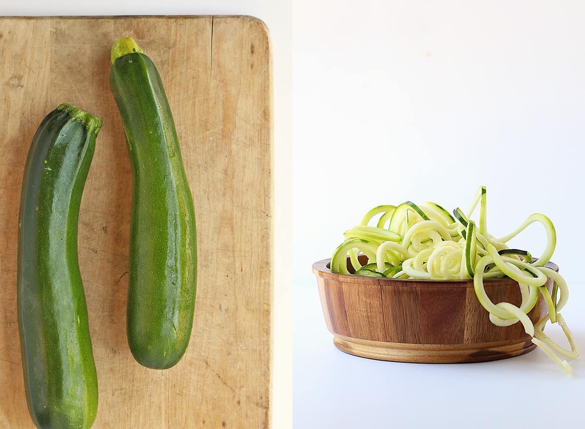 Two zucchini on a wooden cutting board