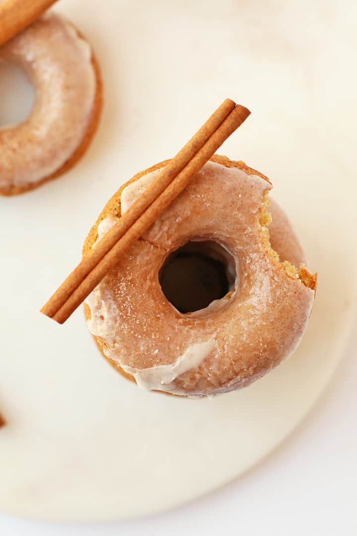 Vegan apple cider donut with a cinnamon stick