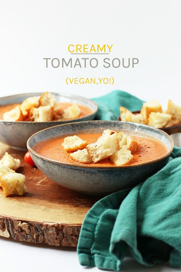 Warm up with this rich and creamy vegan tomato soup. A thick tomato base mixed with cashew cream and topped with homemade croutons for a satisfying fall soup. Made in under 20 minutes!