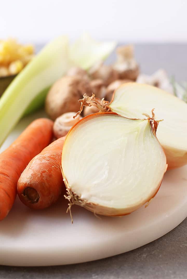 Carrots and onions on a cutting board