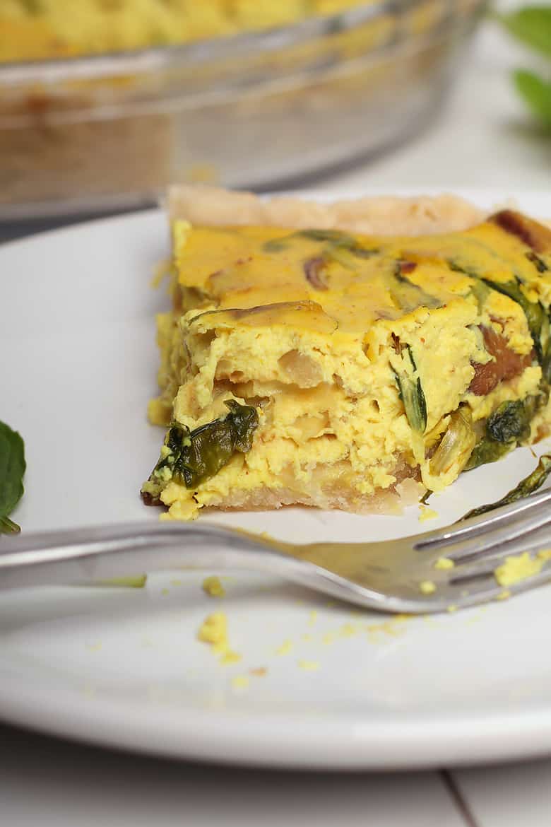 Slice of Vegan Quiche on white plate