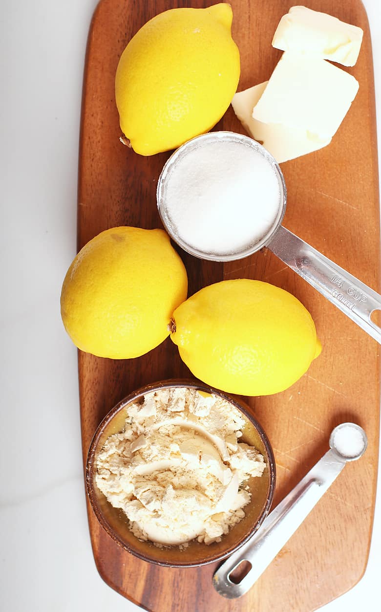 Lemons and sugar on a cutting board