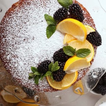 Whole cake with lemons and blackberries