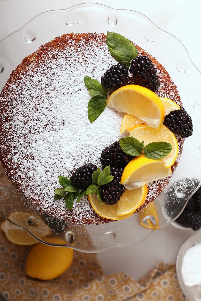 Whole cake with lemons and blackberries