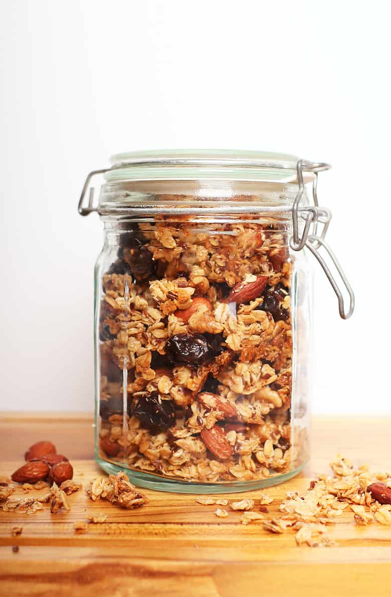 Homemade granola in a jar on a cutting board