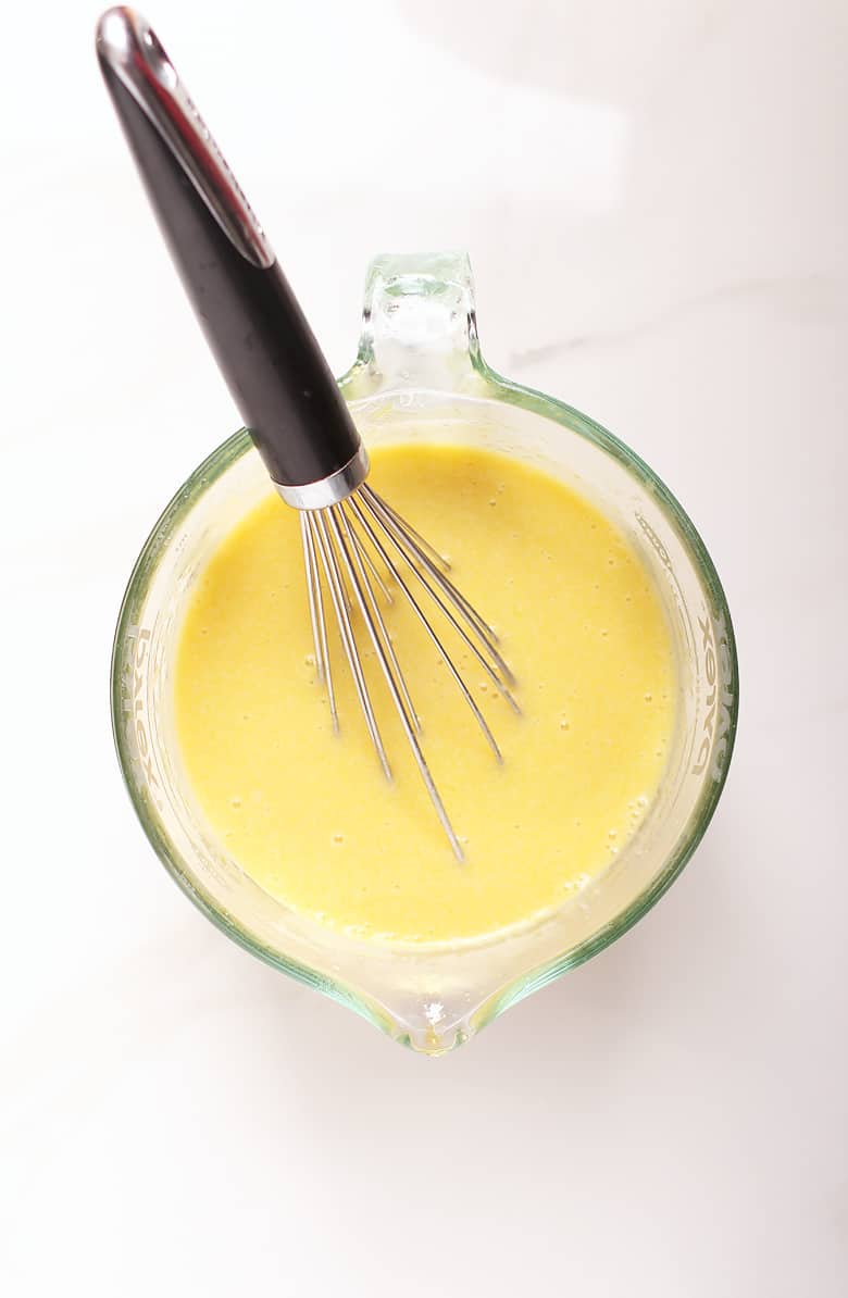 Wet ingredients for cake in liquid measuring cup