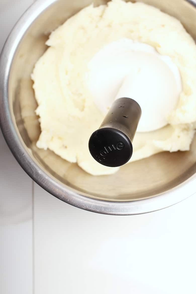 Mashed potatoes in a metal bowl