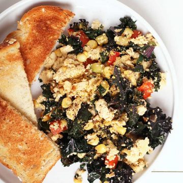 Finished dish on a white plate with toast