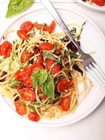 One plate of vegan pasta with cherry tomatoes