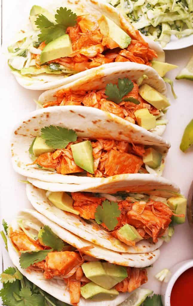 Buffalo Jackfruit tacos on a white board