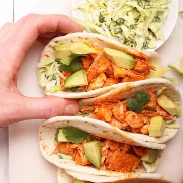 Buffalo Jackfruit tacos on a white board