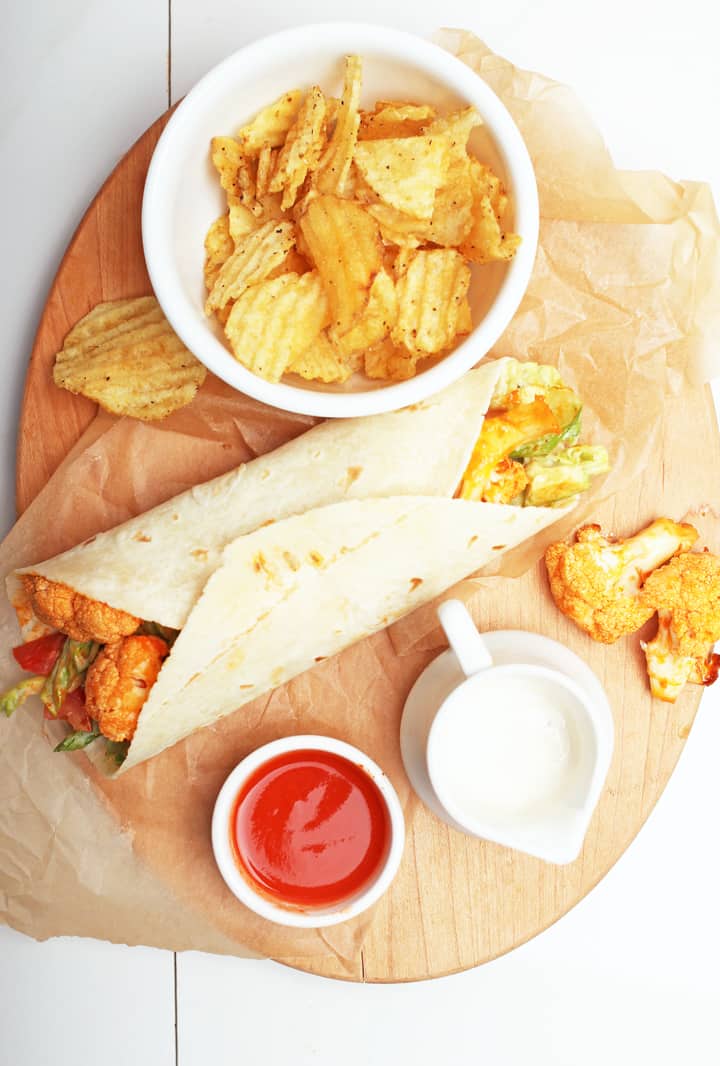 Buffalo Cauliflower Wrap on wooden platter