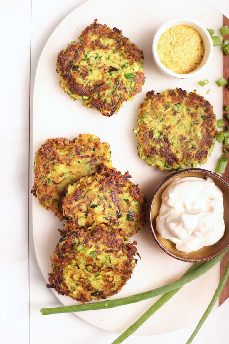 Vegan zucchini fritters on platter