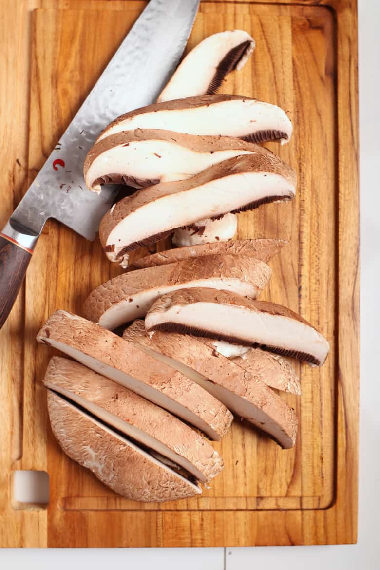 Sliced portobello on a cutting board