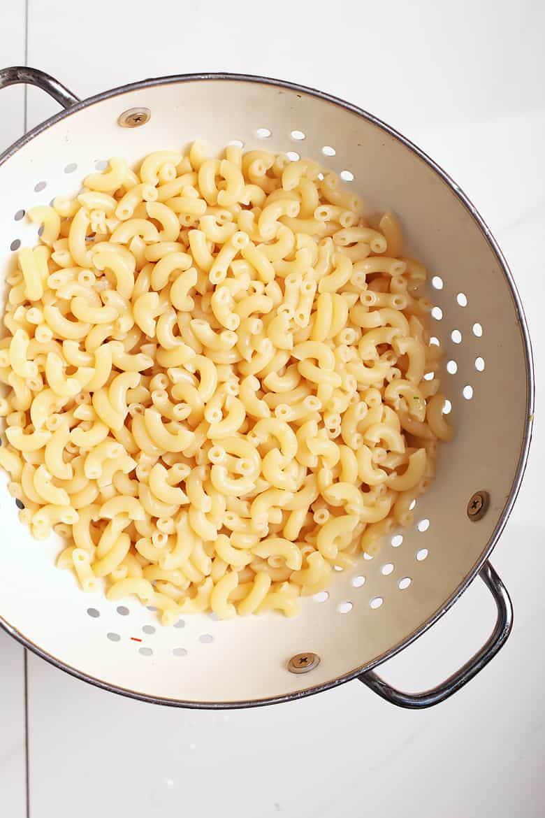 Elbow macaroni pasta in a colander