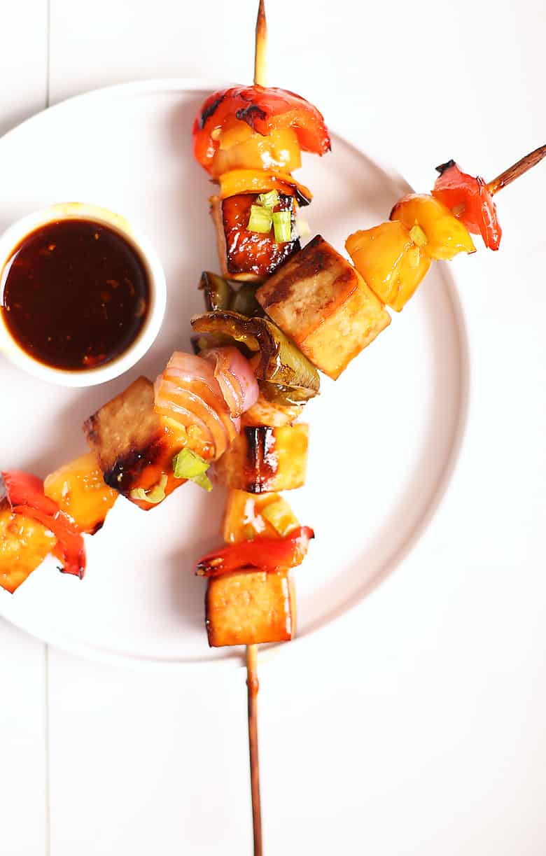 Two Teriyaki Tofu Skewers on a white plate