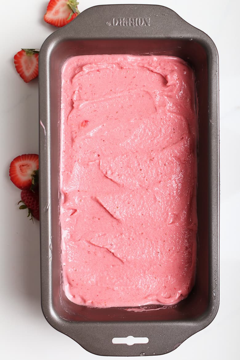 Homemade strawberry ice cream in a loaf pan