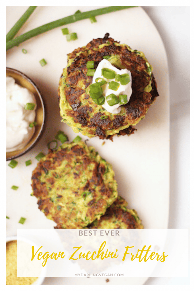 These warm and zesty vegan zucchini fritters!  Made in just 20 minutes, they make the perfect breakfast, lunch, or dinner. Top with vegan sour cream and fresh green onions for a simple and delicious meal. 