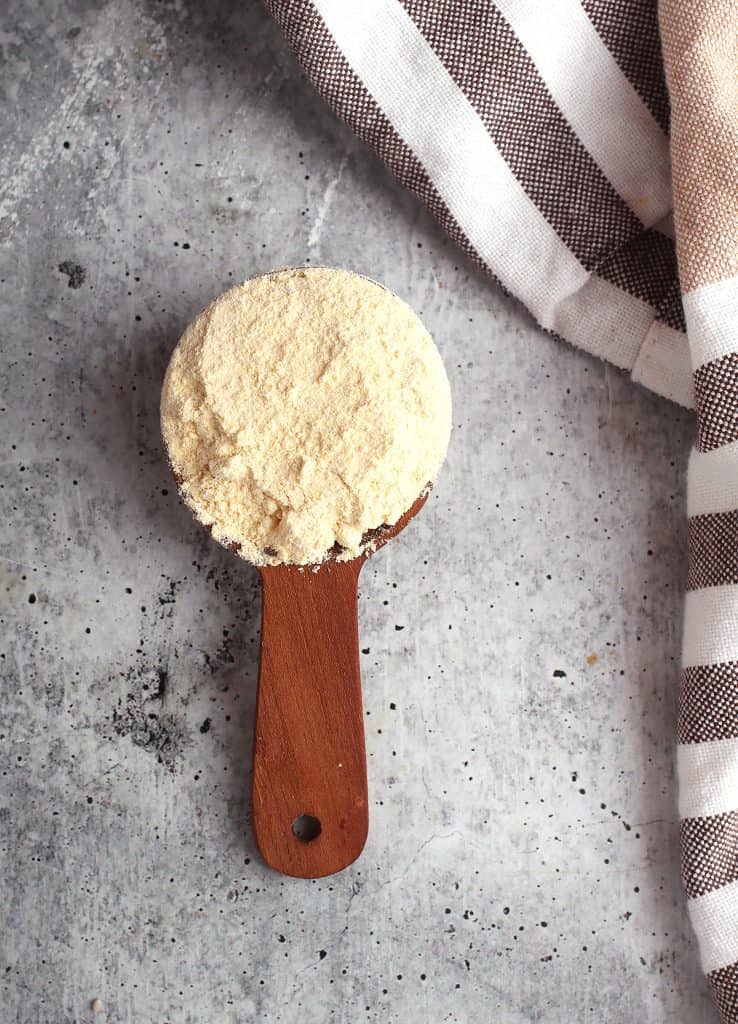 Chickpea flour in a wooden tablespoon
